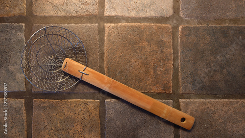 Quadro su tela Asian spider kitchen strainer