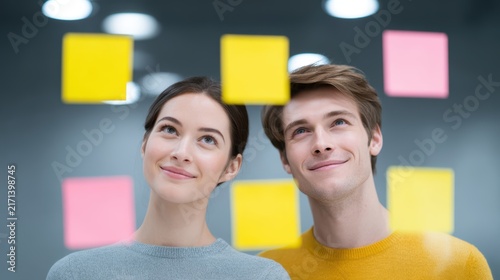 Business colleagues brainstorming with sticky notes in office