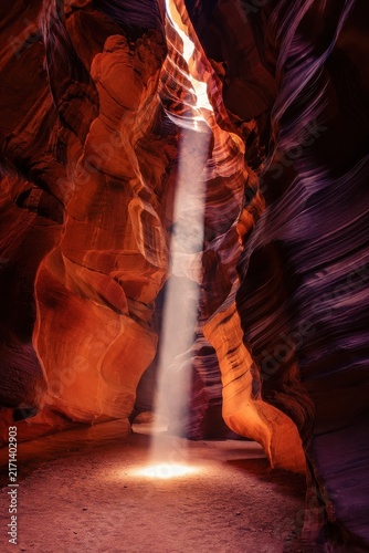 Sunbeam Striking the Floor of a Narrow Red Rock Slot Canyon