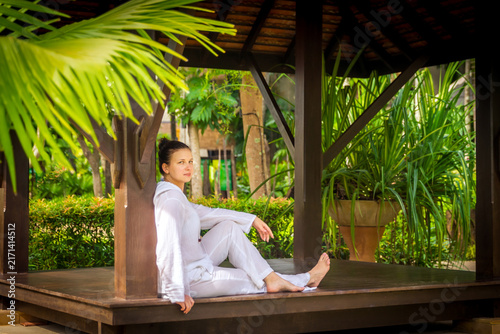 Fotografía Woman sitting in gazebo after practicing yoga
