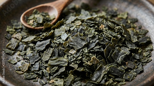 Dried Chopped Seaweed Flakes Detailed Edible Sea Plant Material seaweed kelp kombu dried chopped macro close up texture background sea plant ingredient food organic natural healthy dark ocean marine