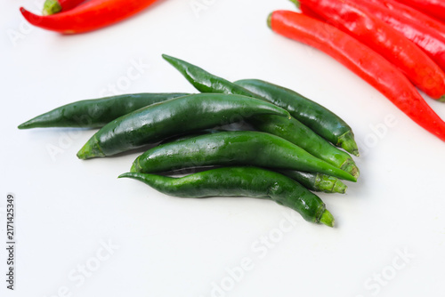 Принти на полотні Fresh red and green chili peppers on a white