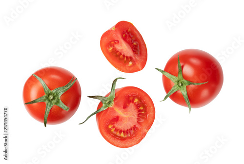 Obraz na płótnie Tomatoes placed on a white background and cut tomatoes