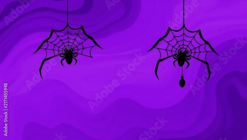 Two black spiders hanging on spider webs against a dark purple background for halloween party decorations