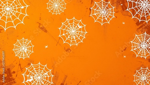 White spider webs pattern on a bright orange background for halloween celebration