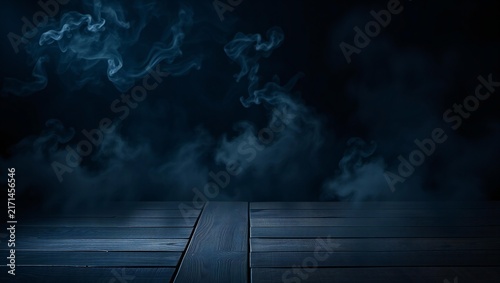Empty wooden table surface with dark blue smoke and mysterious fog in the background