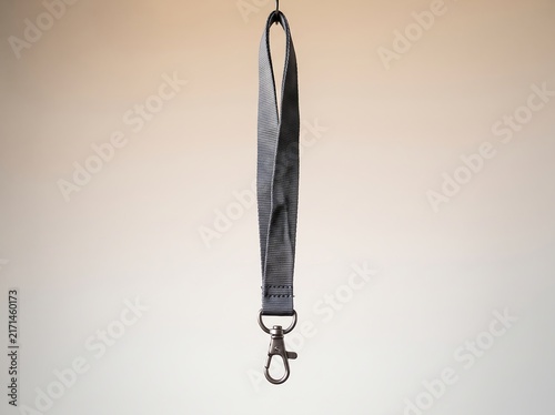 A versatile and robust dark grey fabric lanyard featuring a durable metal clasp, an essential accessory for secure everyday item management and convenient identification display