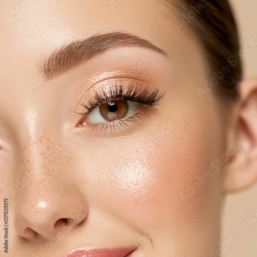 Macro view of woman eye with eyeshadow and perfect eyebrows eye makeup eyebrow styling