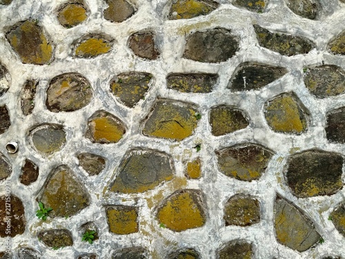 Weathered stone wall background in the garden