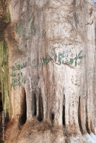 Stalactites hang from a limestone cave ceiling creating a natural wonder.