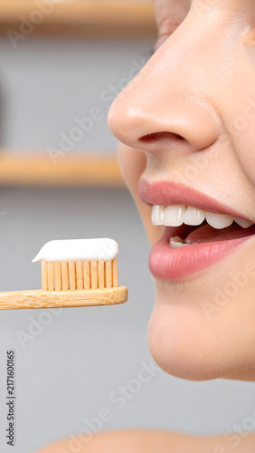 Woman Holding Wooden Toothbrush Near Face Portrait