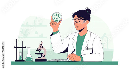 Scientist Examining Petri Dish in Laboratory