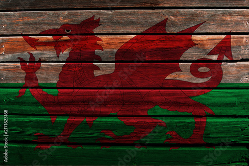 3D Flag of Wales on a old wood wall background.