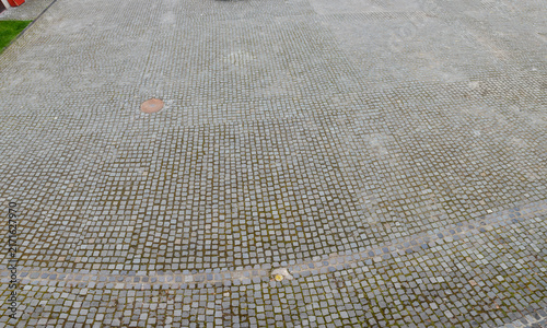 Принти на полотні Aerial view of an extensive cobblestone pavement in an urban setting