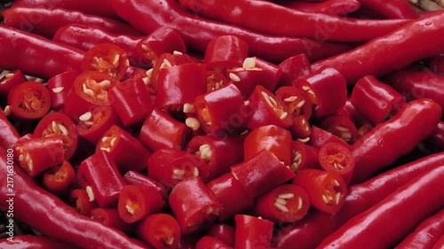 Sliced fresh red chili peppers in a basket	
