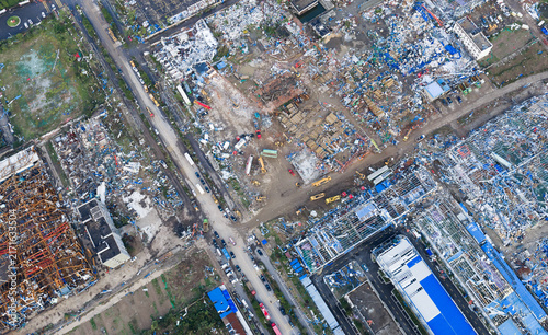 Aerial view of tornado or severe storm aftermath in a devastated industrial area