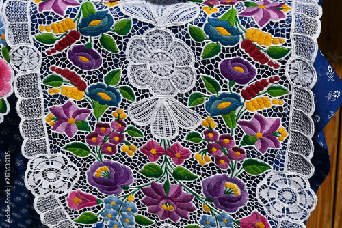 Картината върху платно Kalocsa-patterned embroidered tablecloth with floral design