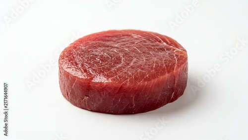 Fresh raw tuna steak medallion isolated on white background