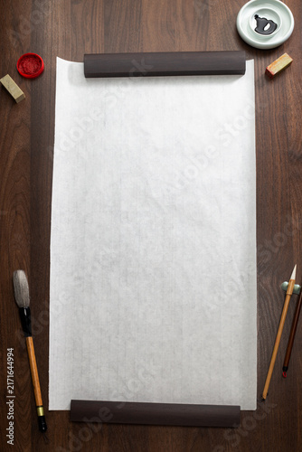 Canvastavla Blank Chinese calligraphy rice paper mockup on dark wooden background with ink,