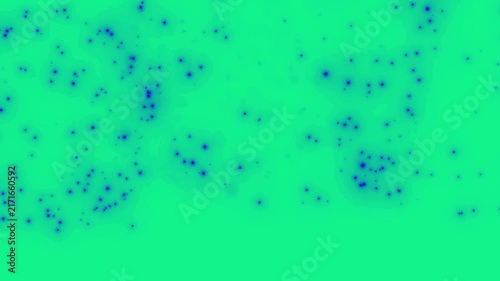 Blue particles and tiny scattered dots float randomly across a vibrant green screen background for video editing.