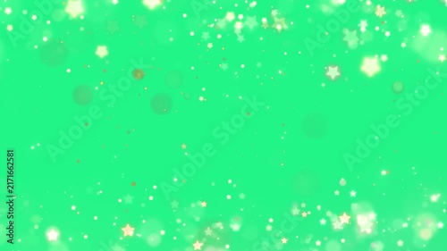 Sparkling star bokeh particles form a decorative glittering frame over a bright green chroma key background.