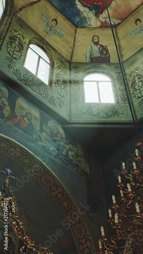 Ornate Chandelier Beneath Painted Vaulted Church Ceiling