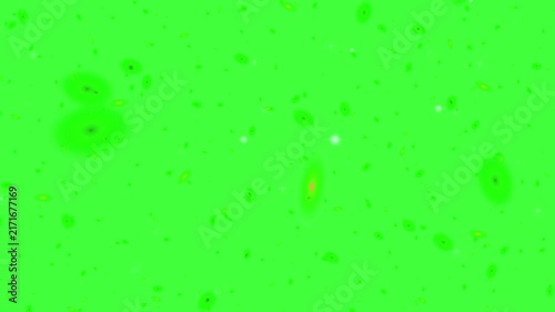 Abstract floating green particles and speckles scatter across a solid vibrant chroma key green background.