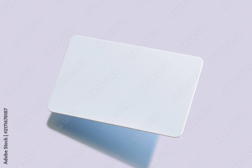 Naklejka premium Blank plastic card with rounded corners floating over a lavender background, featuring a smooth matte finish for gift card and loyalty mockup templates