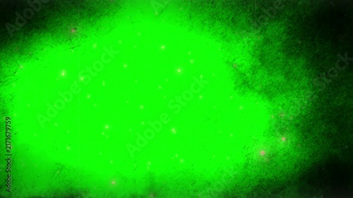 Dark smoky vignette frame with glowing dust particles surrounds a vibrant green screen background for video compositing.