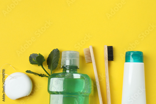 Foto Oral hygiene kit on a yellow background
