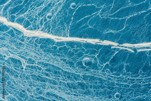Abstract oil water texture with bubbles forming lines