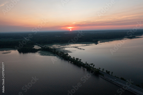 Obraz na plátně Aerial view of cars on causeway at sunrise