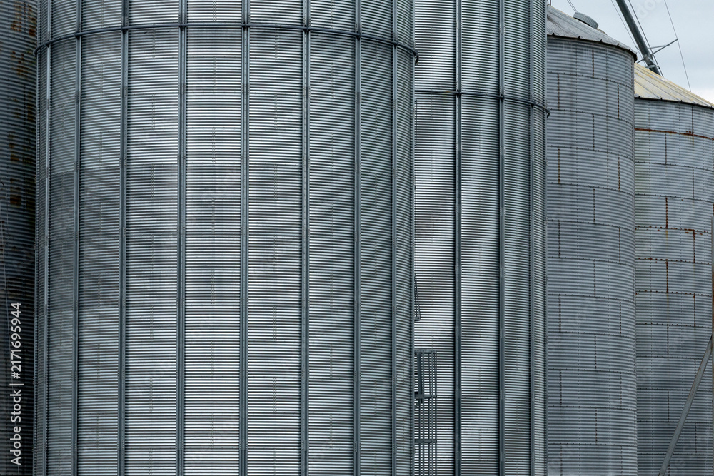 Naklejka premium Textured metal exterior of industrial grain elevators