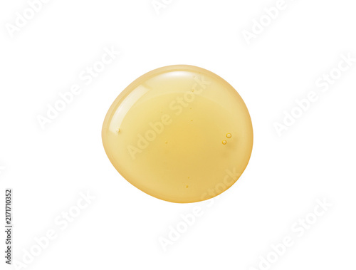 фотографія Honey dripping on white background.