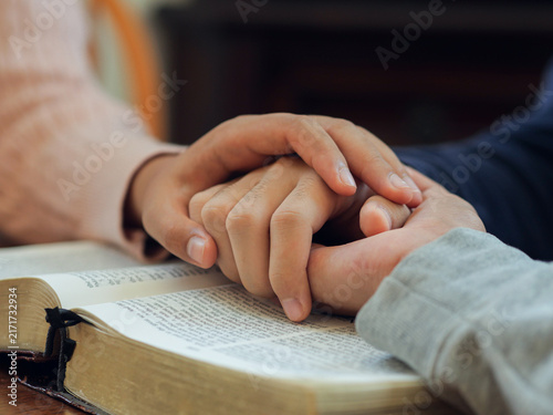 Group of people praying. Christian worship and pray. Christian group of people holding hands praying worships together to believe