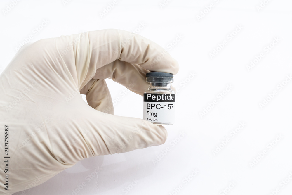 Photography Poster Hand holding BPC 157 peptide vial for research