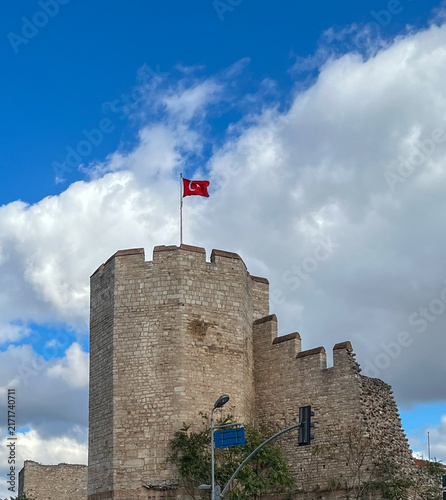 Canvas Print Historic Stone Tower with Turkish Flag on Ancient City Walls Istanbul