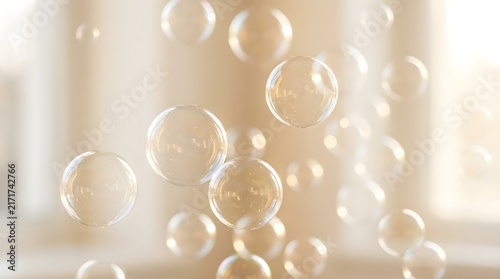 Floating transparent soap bubbles drifting through the air against a soft golden light background captured with beautiful natural bokeh effect