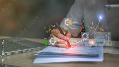 Business professional analyzing AI-powered financial dashboards with real-time market data, investment insights, and interactive analytics for smarter trading and business decisions.