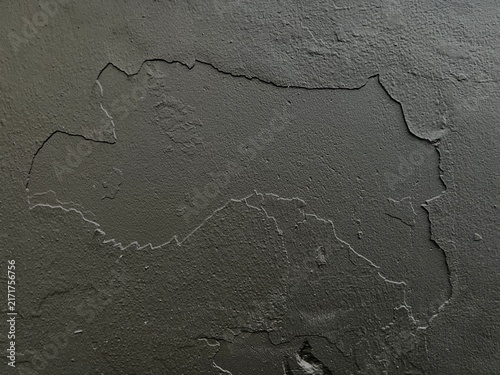 Quadro su tela Textured background of peeling black paint on a rough wall surface