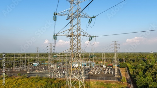 Electric power distribution infrastructure located in a rural landscape during the sunny day