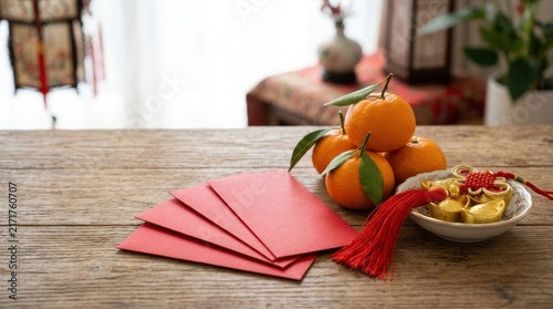Vibrant Red Envelopes and Oranges for Lunar New Year Celebration