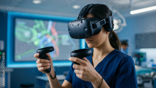 Medical student uses virtual reality in a learning session at a university lab with advanced technology