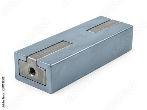 Industrial metal block assembly with steel insert. Rectangular alloy component featuring central groove and threaded hole. Technical engineering part product photography for manufacturing and hardware