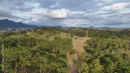 Aerial Drone View of a Scenic Pine Hill and Lush Green Vegetation in Da Lat, Vietnam, Showcasing the Peaceful Mountain Landscape and Natural Beauty of the Central Highlands
