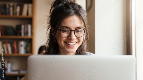 Happy woman working with laptop