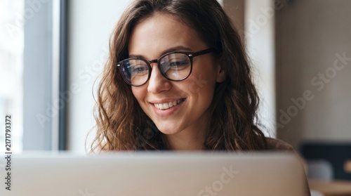 Happy woman working with laptop