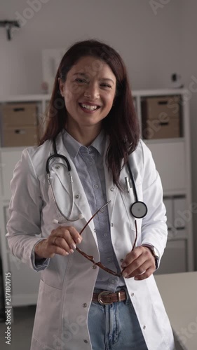 Professional female doctor smiling in her office