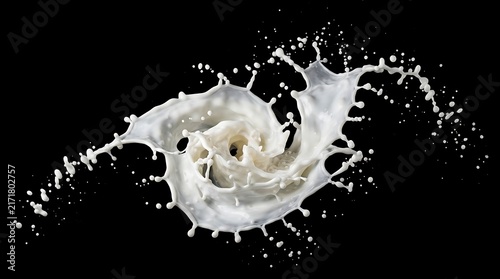 A circular swirl of fresh white milk splashing and creating dynamic ripples against a dark black background