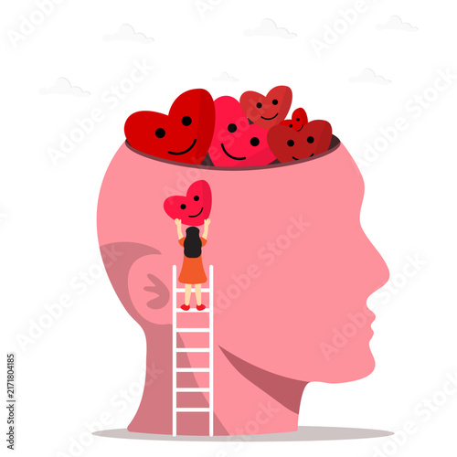 A woman on ladder placing smiling heart into pink head filled with happy hearts. Concept of mental health, positivity, love, self care, happiness, emotional wellbeing and psychological support.